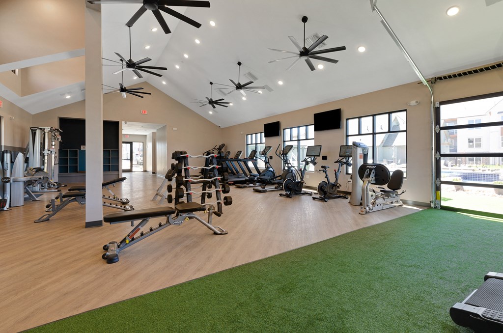 a spacious fitness center with treadmills and other exercise equipment  at Upland Flats, Colorado Springs, CO