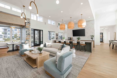 A living room with a grey sofa and a wooden coffee table.