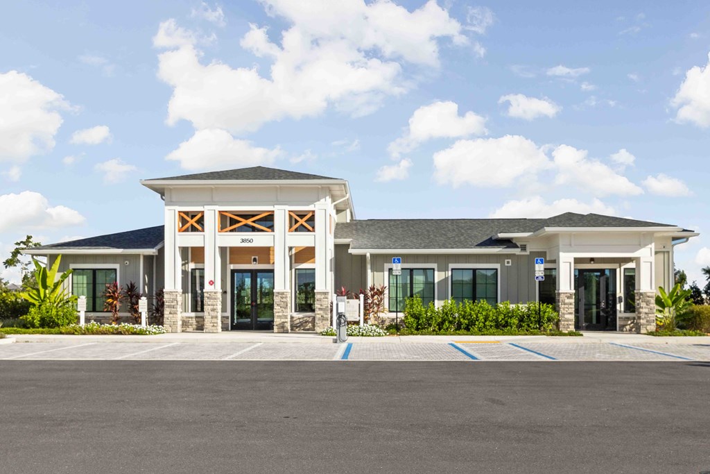 A building with a parking lot in front of it.