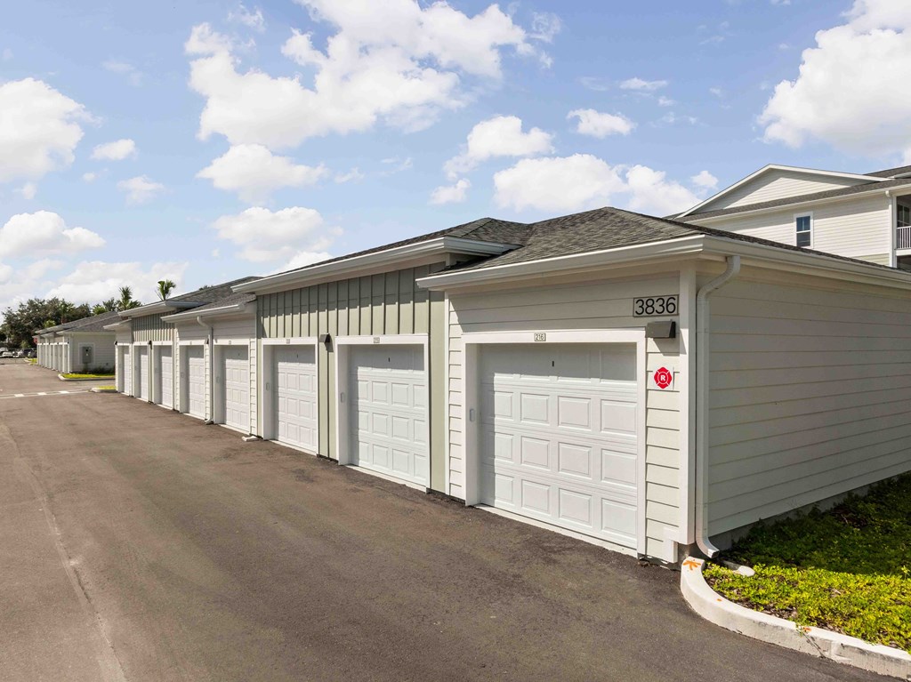 A long row of garages with the number 3336 on the front of the first one.