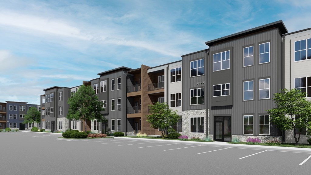 A row of modern apartment buildings are shown in the image at Switch Luxury Living in Colorado Springs, CO