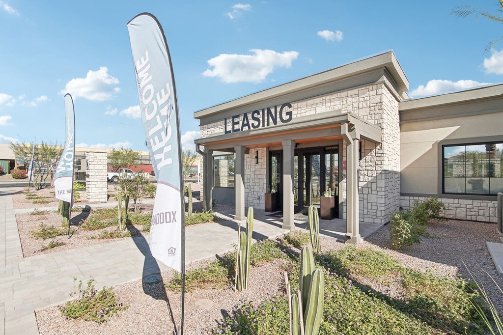 a rendering of a building with cactus in front of it at The Maddox Luxury Apartment Homes, Arizona