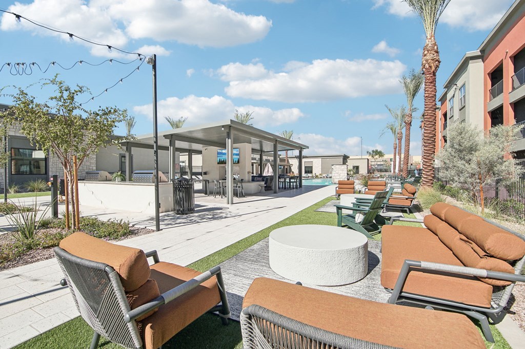a lounge area with couches and chairs and tables at the resort at The Maddox Luxury Apartment Homes, Buckeye, AZ