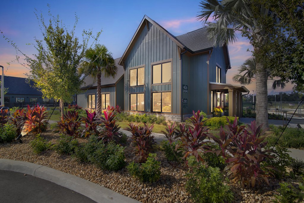 a home with a landscaped garden in front of it at Canter, Ocala