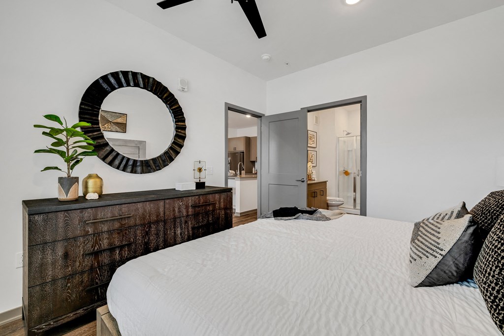 a bedroom with a large bed and a wooden dresser  at Prism at Diamond Ridge, Pennsylvania, 15108