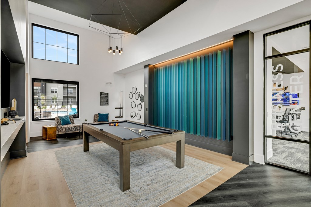a spacious living room with a pool table in the middle of the room  at Prism at Diamond Ridge, Moon Township, Pennsylvania