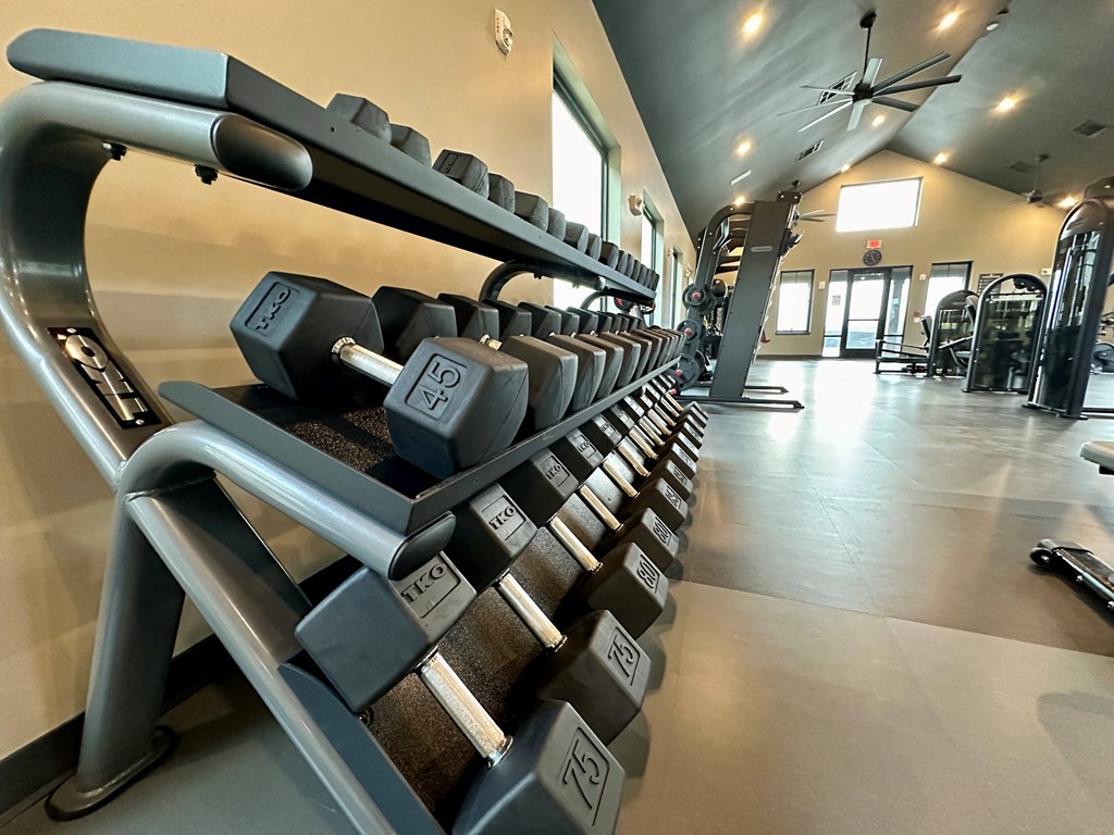 a row of dumbbells in a gym at The Depot, Raymore, 64083