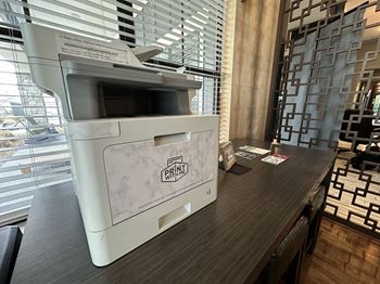 a printer in a hotel room in front of a window at Watermark at Steele Crossing, Arkansas