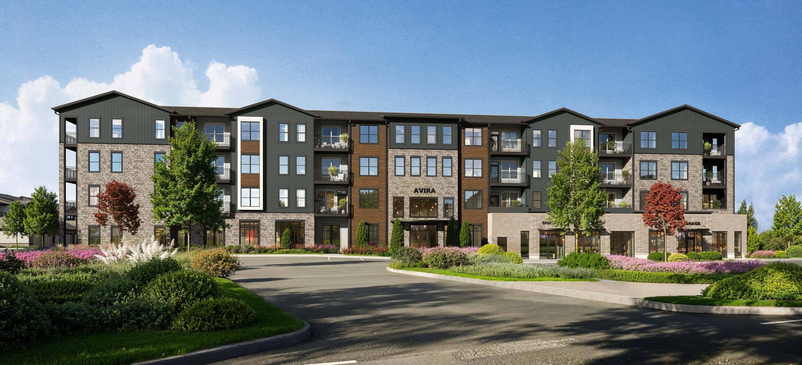 A large apartment complex with a driveway in front.