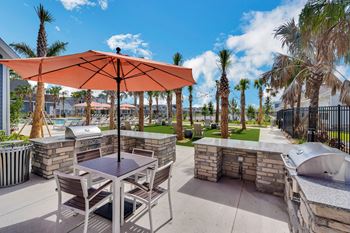 a patio with a table and chairs and a hot tub at The Sophia, Venice, FL, 34275