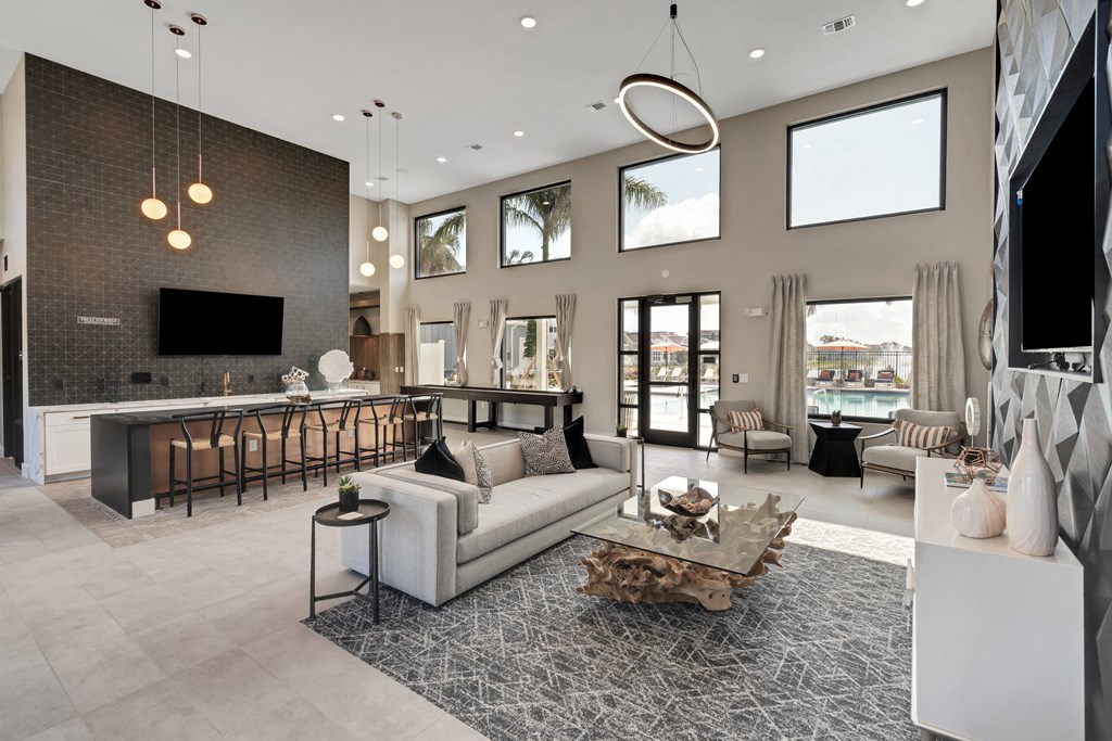 Large living room with dining tables at The Sophia, Venice, FL, 34275