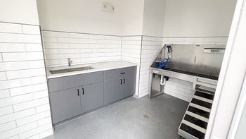 a kitchen with a sink and a stove in it at The Depot, Raymore, 64083