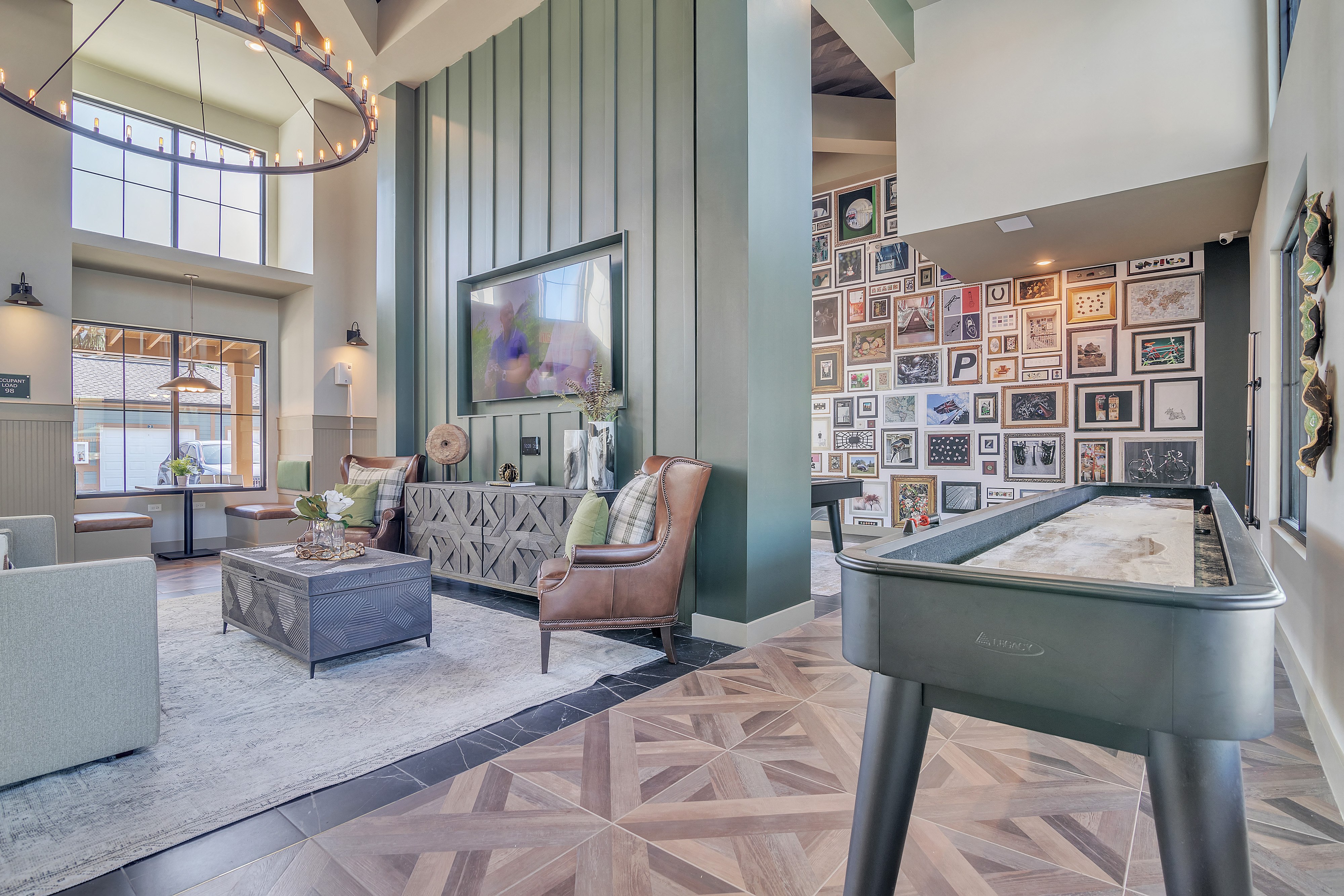 a living room with a foosball table and a couch
