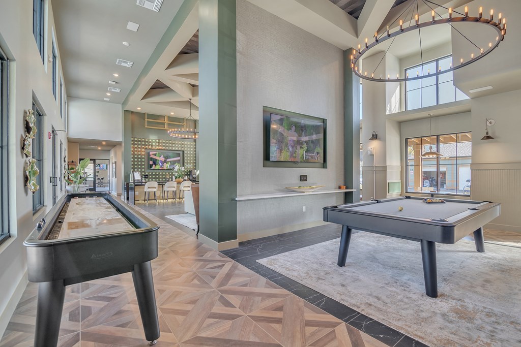 a game room with two shuffleboards and a pool table at Canter, Florida, 34474