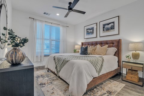 a bedroom with a large bed and a ceiling fan at Canter, Florida