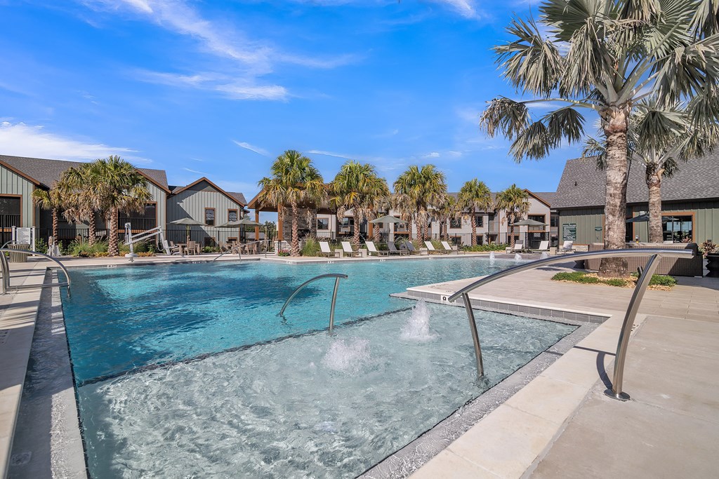 resort style swimming pool with palm trees at Canter, Florida, 34474
