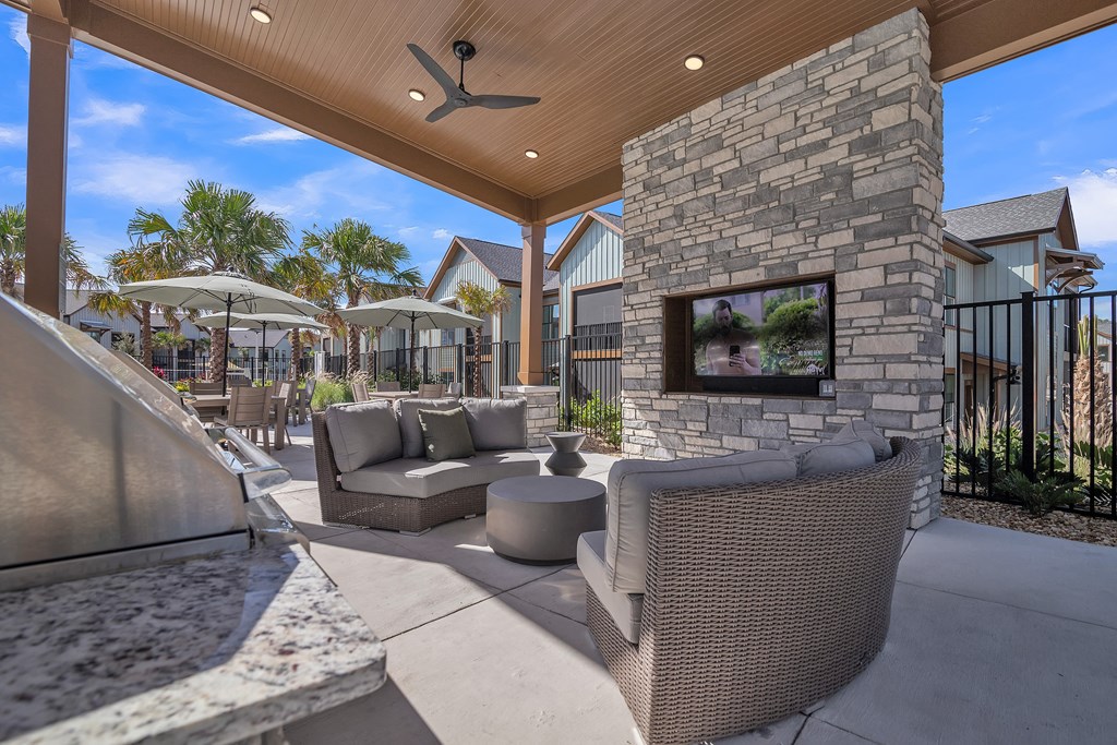 common outdoor patio with furniture and a fireplace at Canter, Ocala, FL, 34474