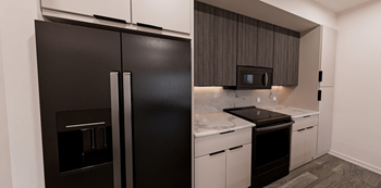 A black refrigerator is in a kitchen at Verity Luxury Apartment Homes Apartments, Vero Beach, FL 32960