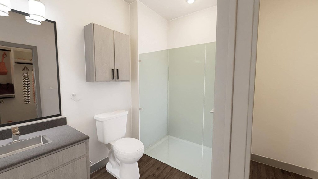 a bathroom with a toilet and a glass shower at Stella, Arizona