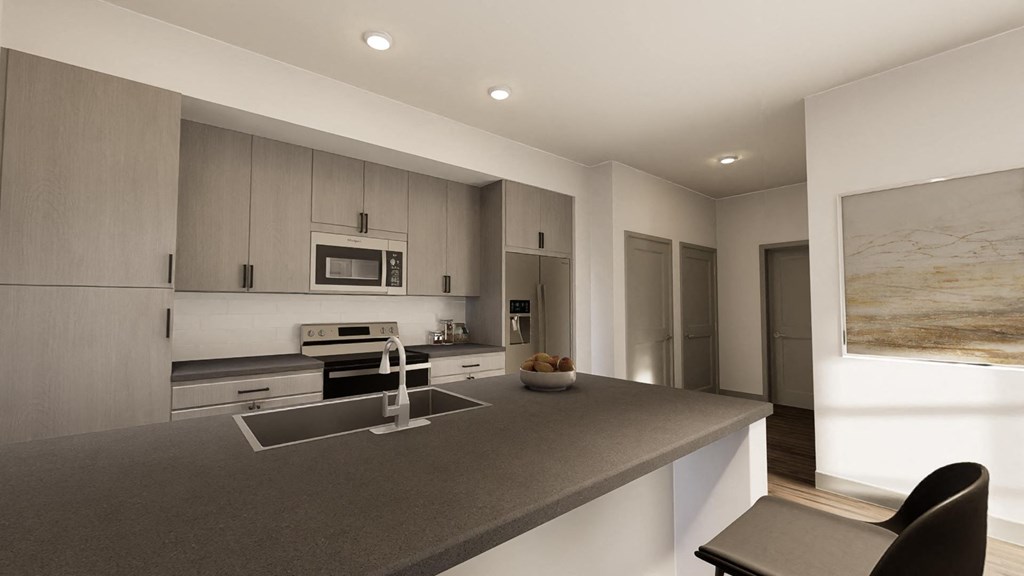 a modern kitchen with gray countertops and stainless steel appliances at Stella, San Tan Valley Arizona