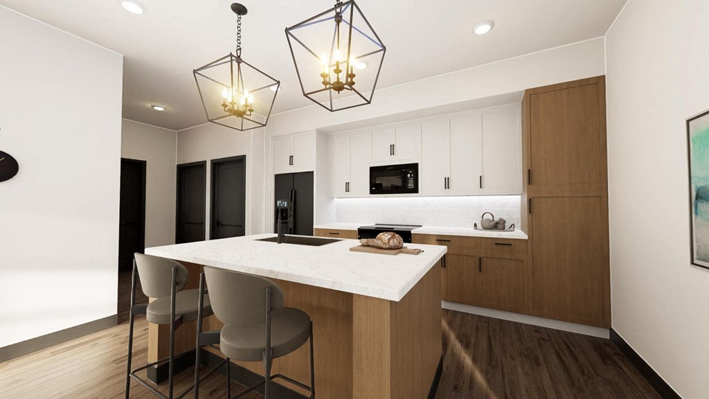 a kitchen with a large island and two lights at Stella, Arizona, 85142