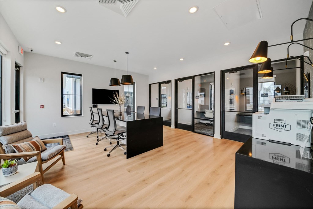 a living room with a kitchen and a table and chairs  at The BLVD at Wilson Crossings, Wyoming