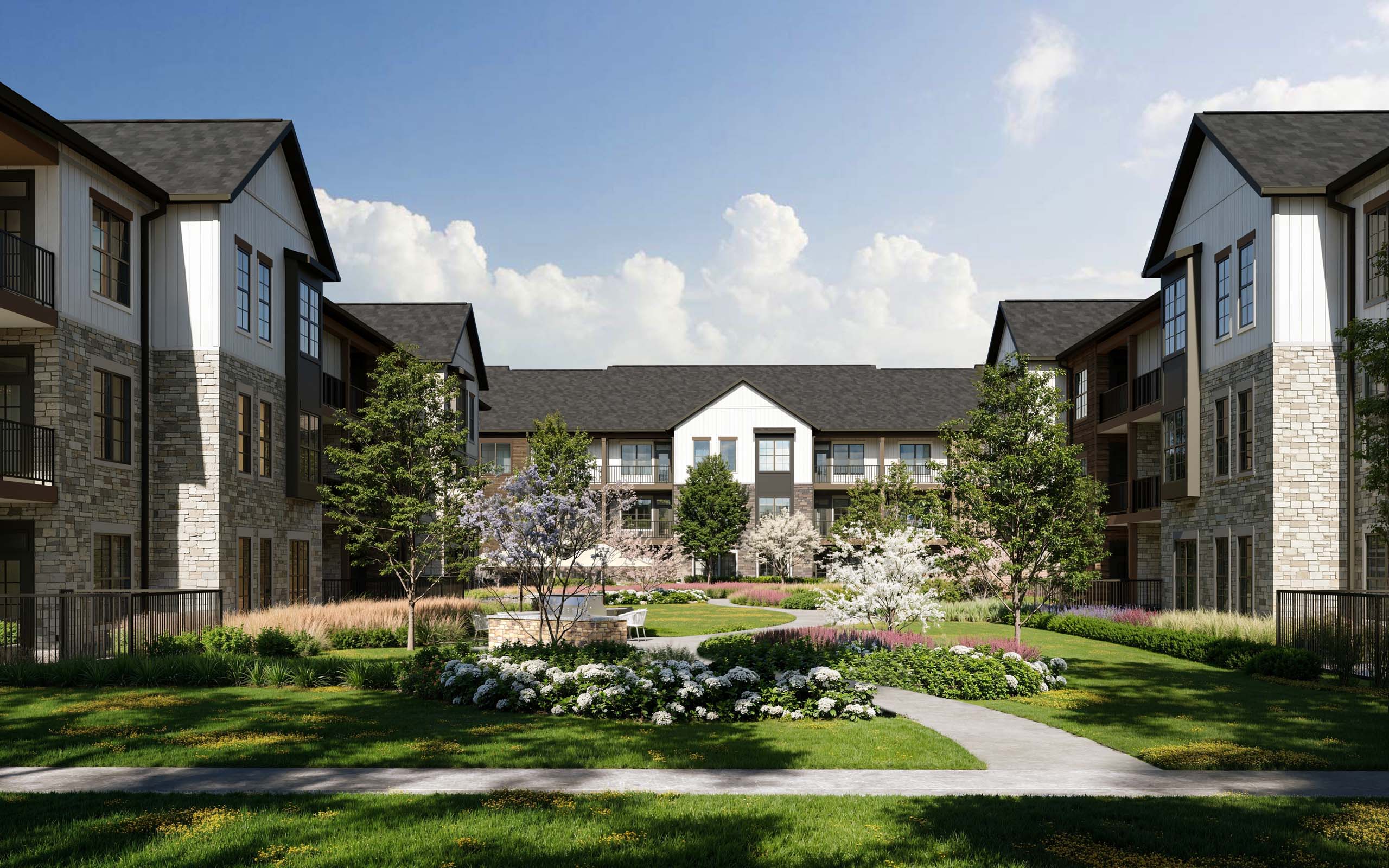 A row of houses with a garden in front.