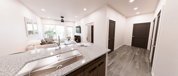 A modern kitchen with granite countertops and a large island at Verity Luxury Apartment Homes Apartments, Vero Beach, FL