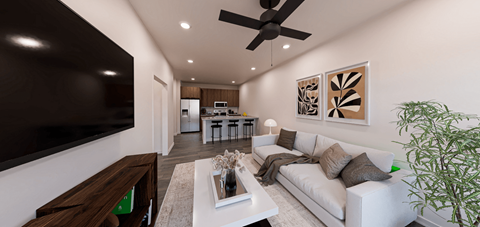 A modern living room with a white couch and a large flat screen TV mounted on the wall at Verity Luxury Apartment Homes Apartments, Florida, 32960