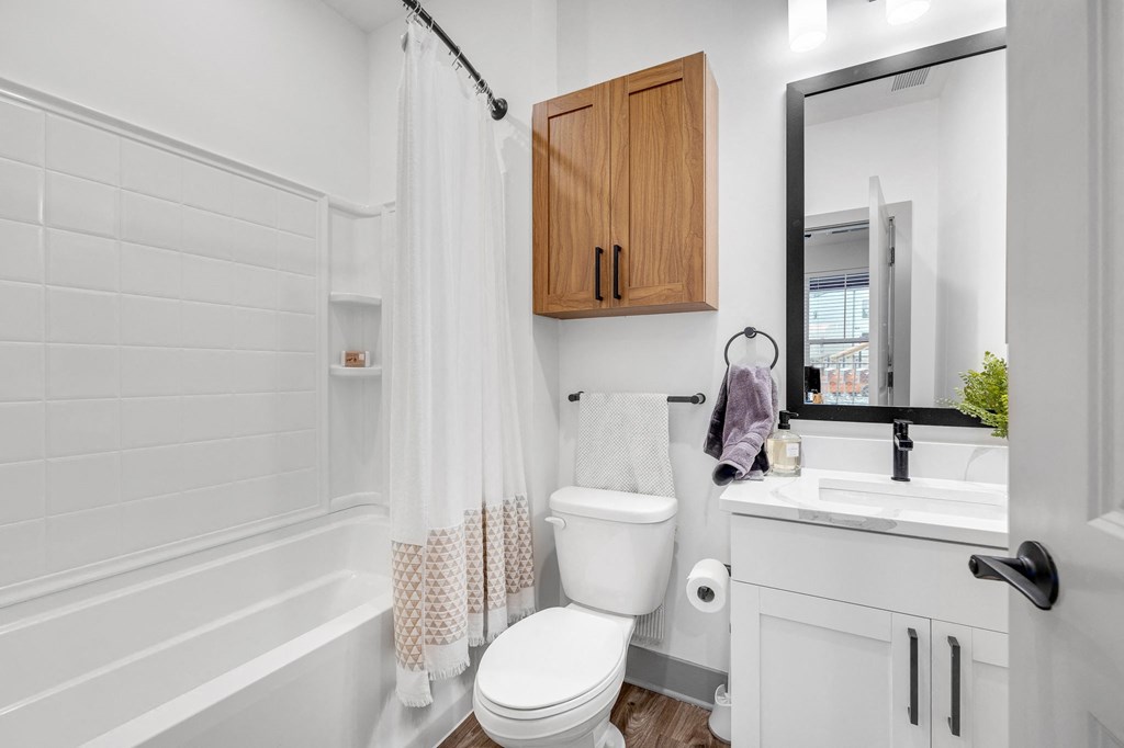 a small bathroom with a toilet and a sink at Meridian at CityPlace, Minnesota