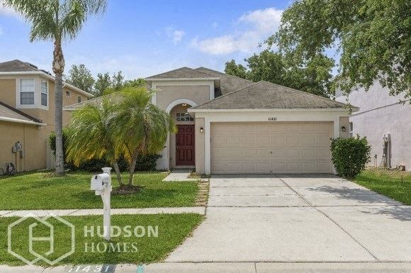 Hudson Homes Management Single Family Home For Rent Pet Friendly 11431 Villagebrook Dr Riverview FL 33569 4 bedrooms 2 bathrooms carpet dishwasher refrigerator microwave laundry room two car garage screened back porch ceiling fans - Photo Gallery 1