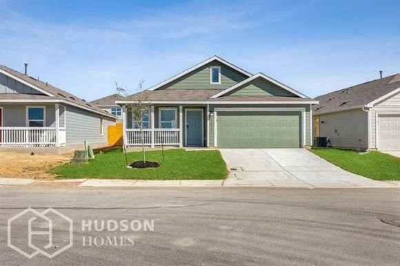 a house with a driveway and a garage door