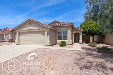 a house with a driveway and a garage door