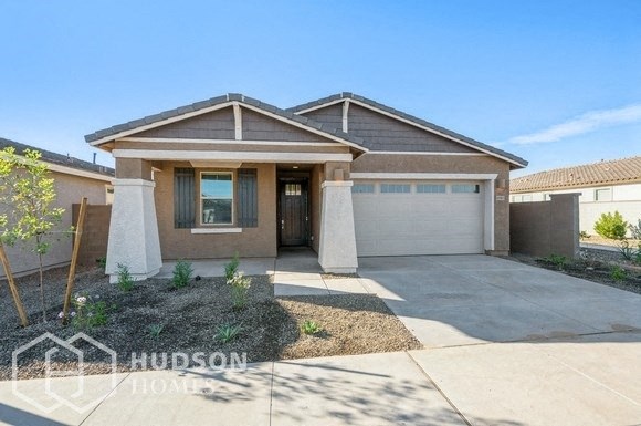 a house with a driveway and a garage door