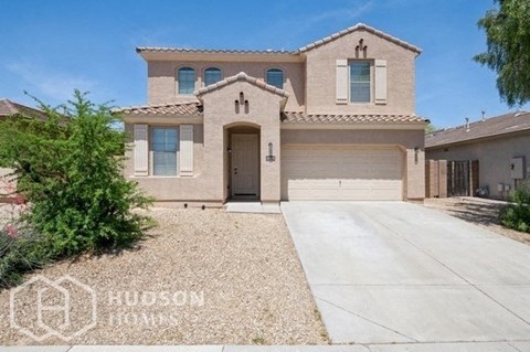 a house with a driveway and a garage door