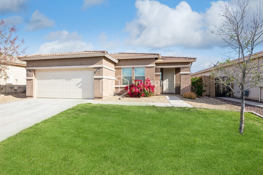 a house with a garage and a lawn