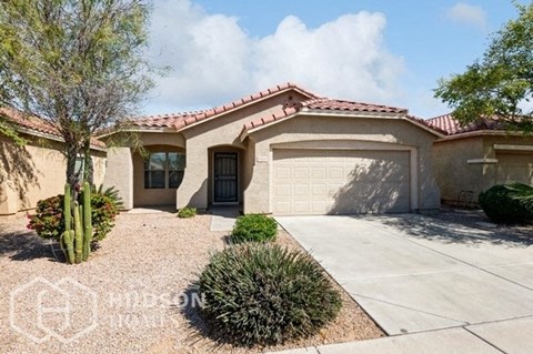 a house with a driveway and a garage door