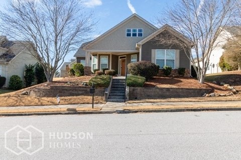 a house on a street with stairs in front of it