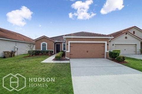 a house with a driveway and a garage door
