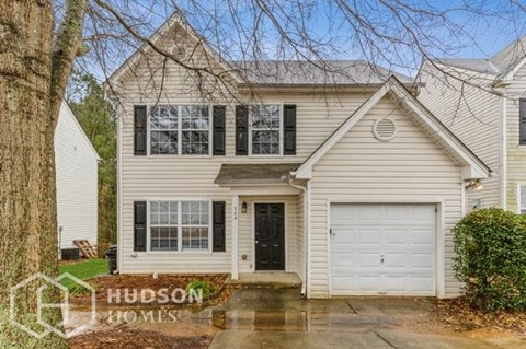a white house with a white garage door