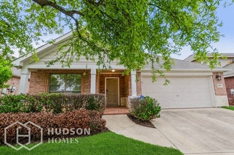 a house with a driveway and a white garage door