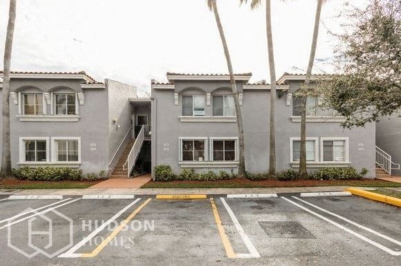 Hudson Homes Management Single Family Home For Rent Pet Friendly 4732 NW 114th Ave 203 Doral FL 33178 3 bedrooms 2 bathrooms refrigerator dishwasher ceiling fans carpet bedrooms private balcony - Photo Gallery 1