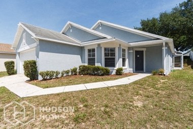Hudson Homes Management Single Family Home For Rent Pet Friendly 611 Berwick Davenport FL 33897 Pool Screened in Porch Attached Garage