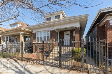 Hudson Homes Management Single Family Home For Rent Pet Friendly 6231 S Francisco Ave Chicago IL 60629 3 bedrooms 2 bathrooms back yard carpet hardwood refrigerator microwave fireplace detached garage basement washer dryer connections