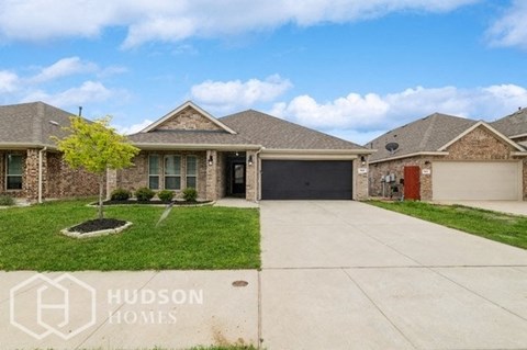 a house with a driveway and a garage door