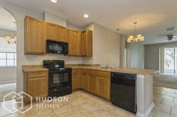 Hudson Homes Management Single Family Home For Rent Pet Friendly 11431 Villagebrook Dr Riverview FL 33569 4 bedrooms 2 bathrooms carpet dishwasher refrigerator microwave laundry room two car garage screened back porch ceiling fans - Photo Gallery 4