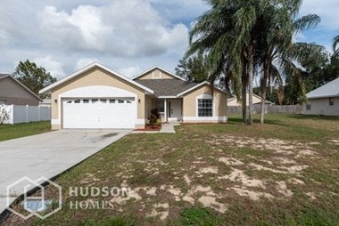 Hudson Homes Management Single Family Home For Rent Pet Friendly 118 Pin Oak Pl Davenport FL 3 bedrooms 2 bathrooms carpet vaulted ceilings tall ceilings two car garage large living area