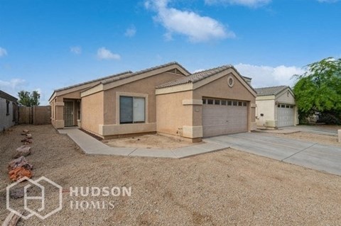 a house with a driveway and a garage door