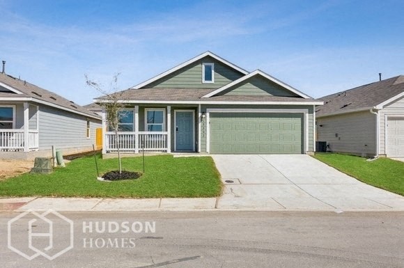 a house with a driveway and a garage door
