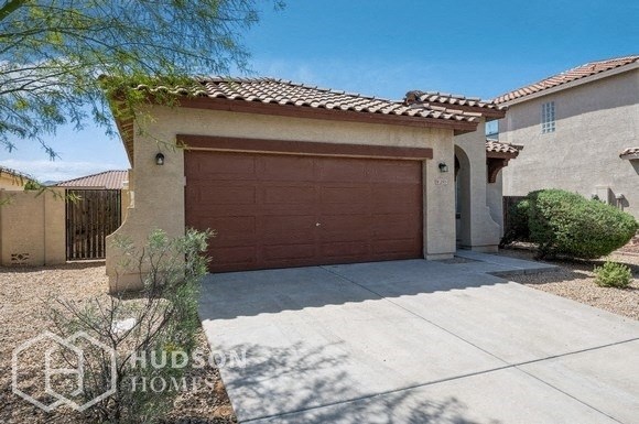 a garage door in front of a house with a driveway